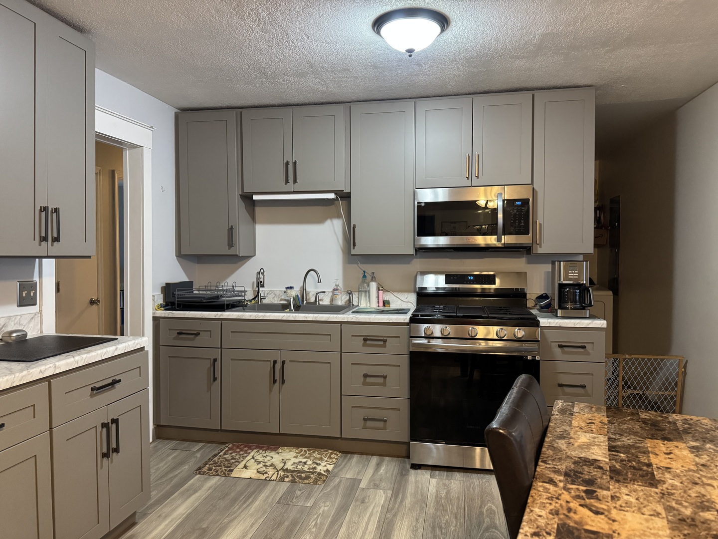 910 West Kennedy Road Braidwood, IL 60408 - Photo 7 of 23 a kitchen with granite countertop a sink stove and cabinets