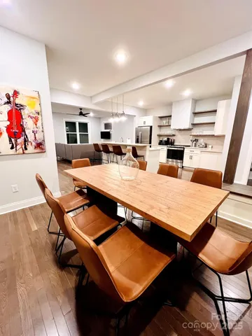 a spacious bathroom with a sink a mirror and a potted plant