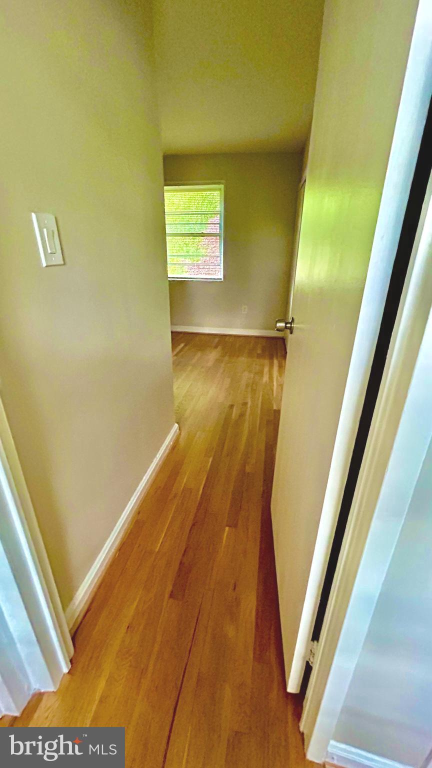 5319 Pooks Hill Road, Unit 1 Bethesda, MD 20814 - Photo 18 of 37 a view of a room with wooden floor