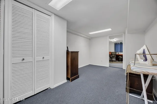 a view of kitchen with furniture and white appliances