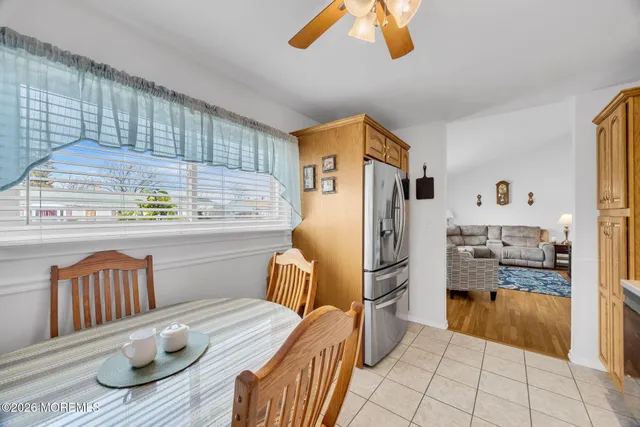 a kitchen with stainless steel appliances granite countertop a refrigerator and a stove