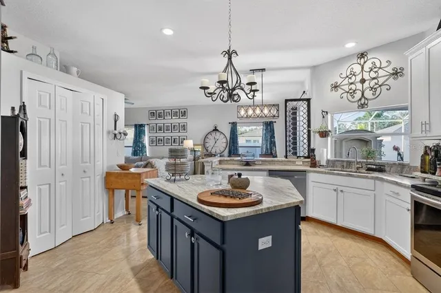 a kitchen with a sink stove and refrigerator