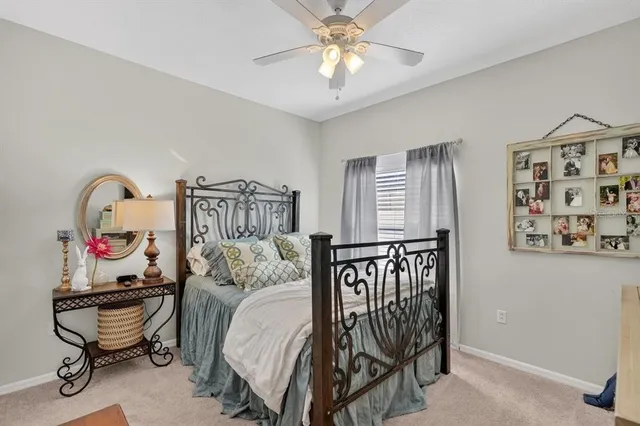 a bedroom with furniture and a chandelier