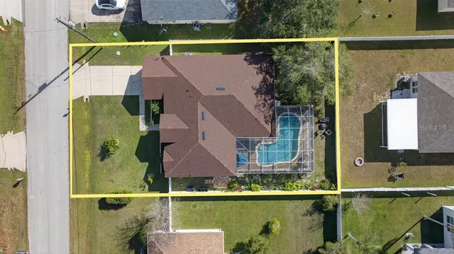 an aerial view of houses with outdoor space