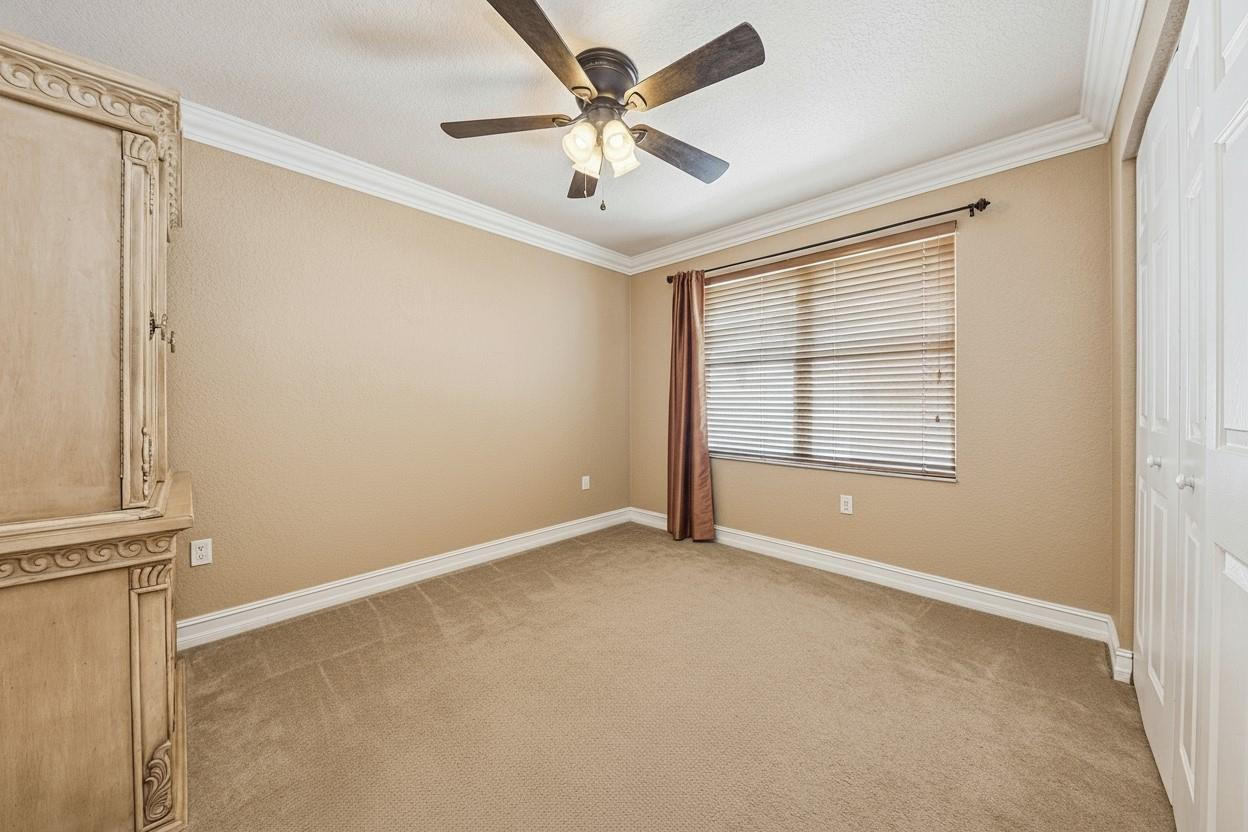 2755 Southwest 165th Avenue Miramar, FL 33027 - Photo 15 of 18 an empty room with windows and fan