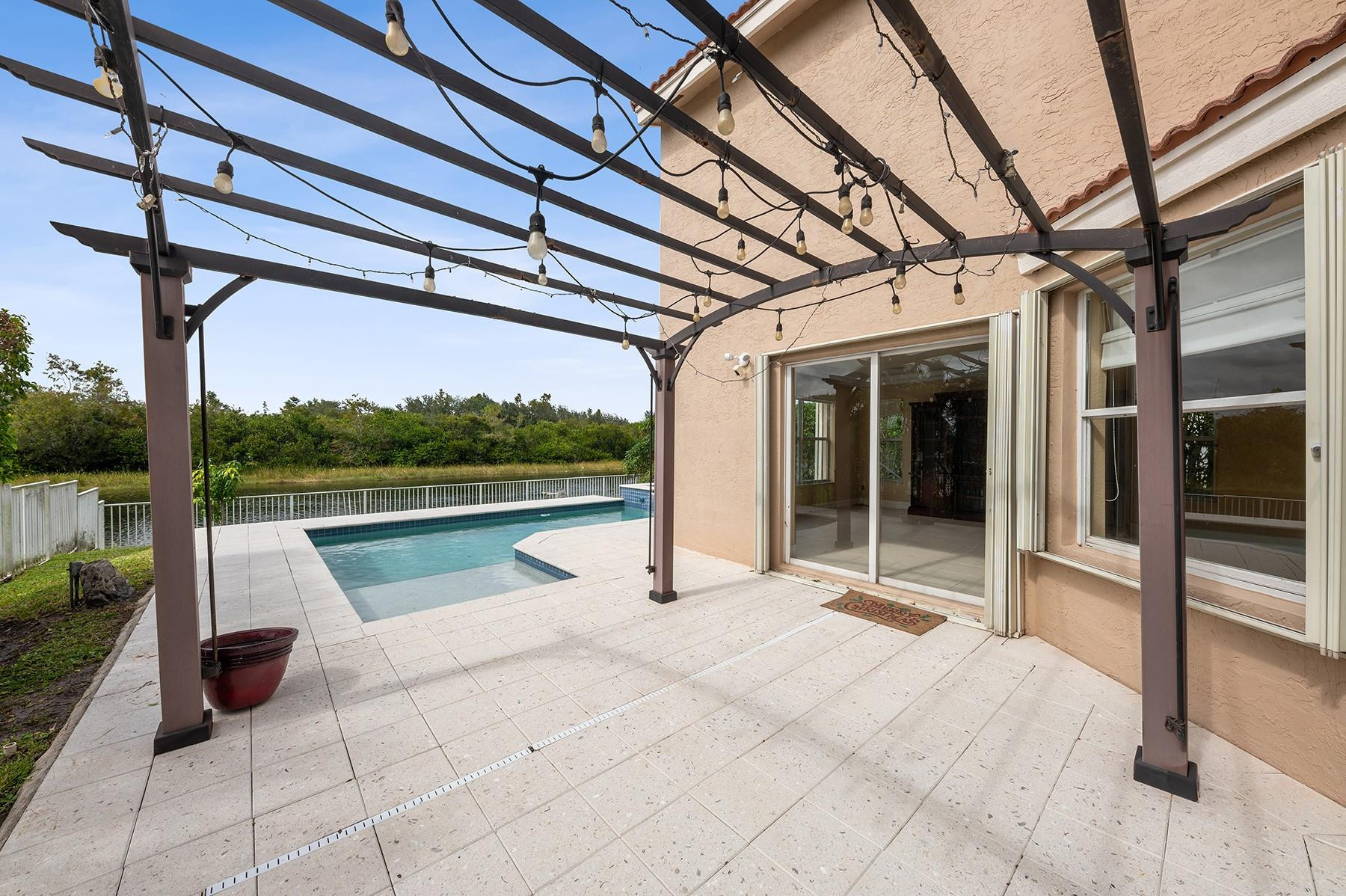 2755 Southwest 165th Avenue Miramar, FL 33027 - Photo 16 of 18 a view of pool with seating area