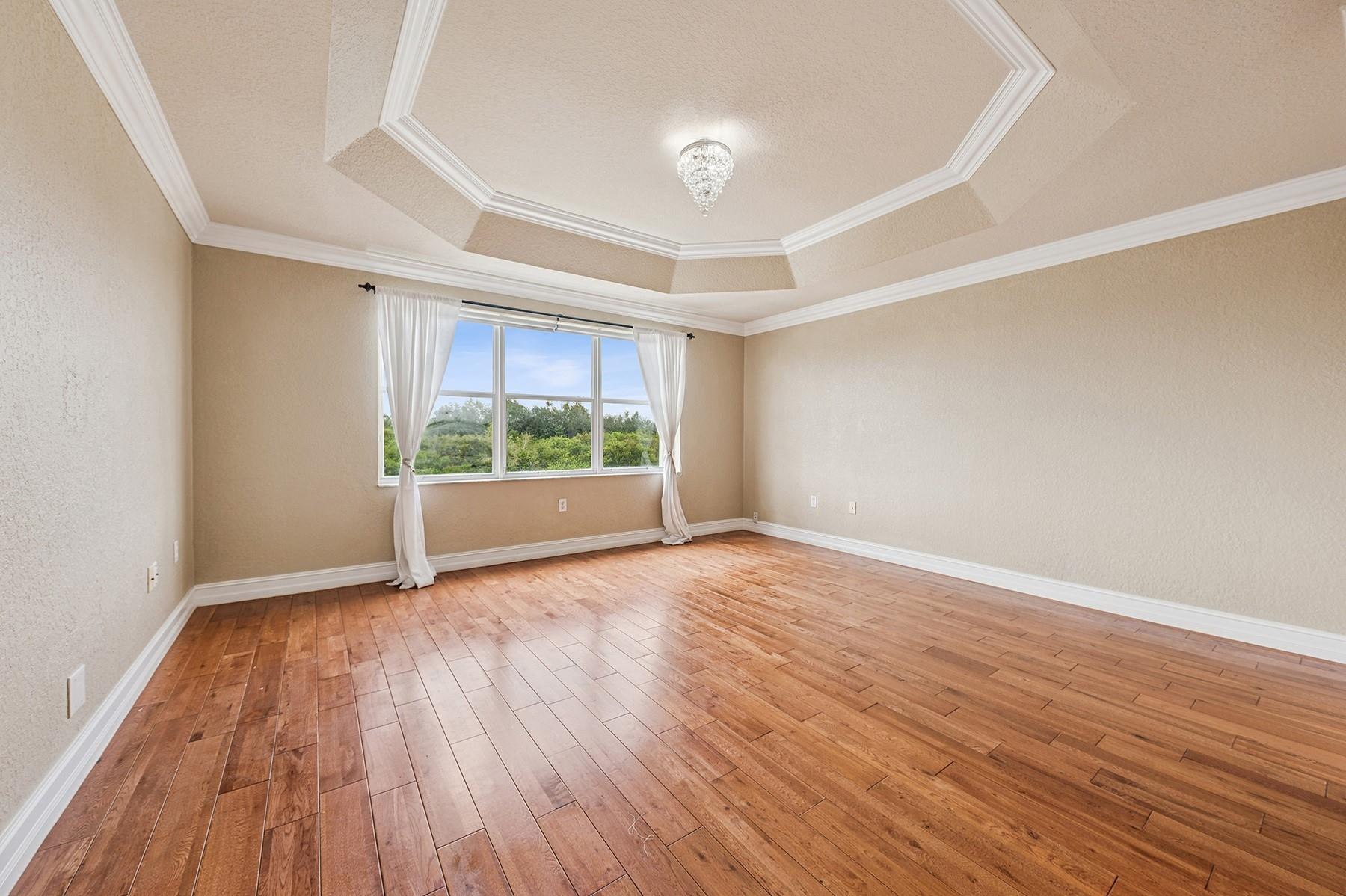 2755 Southwest 165th Avenue Miramar, FL 33027 - Photo 10 of 18 wooden floor in an empty room with a window