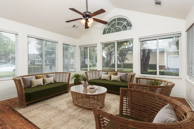 a living room with furniture and a large window