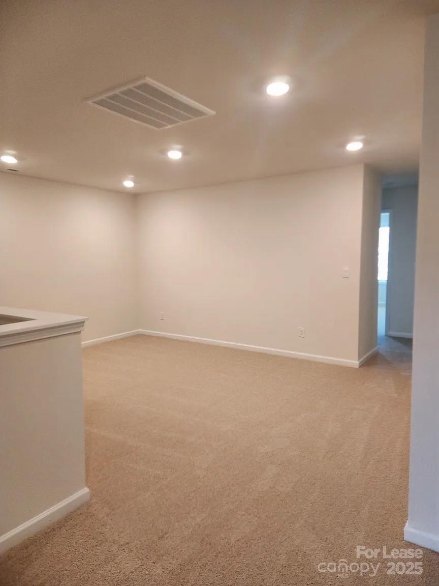 4146 Steel Way Sherrills Ford, NC 28673 - Photo 5 of 12 an empty room with a empty space and windows