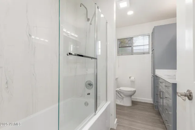 a bathroom with a shower and a toilet
