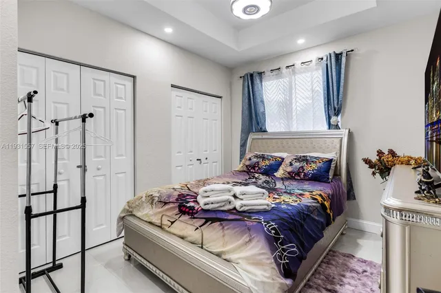 a bed room with a bed and a couch