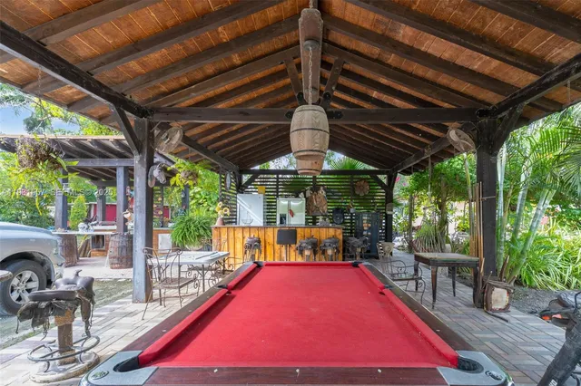 a car parked in front of a house next to a yard