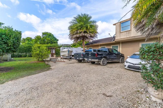 a view of street with large trees