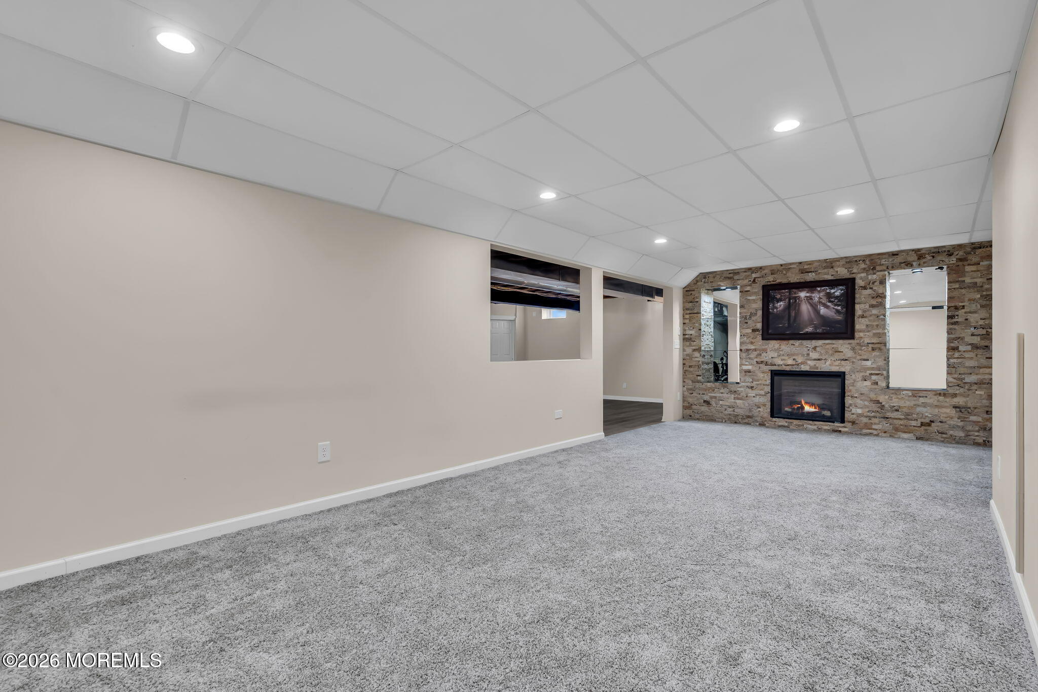81B North Locust Avenue, Unit A Marlton, NJ 08053 - Photo 52 of 87 an empty room with a fireplace and a window