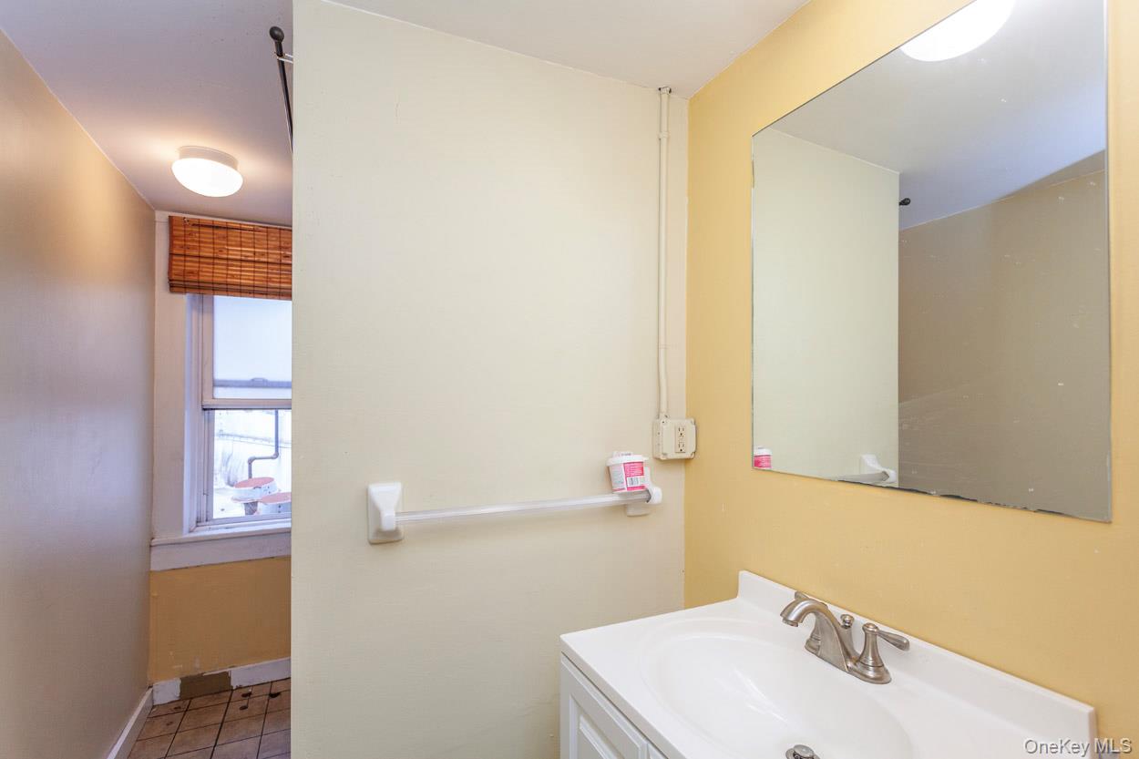 14 South Division Street, Unit 3 Peekskill, NY 10566 - Photo 12 of 17 a bathroom with a sink and a mirror