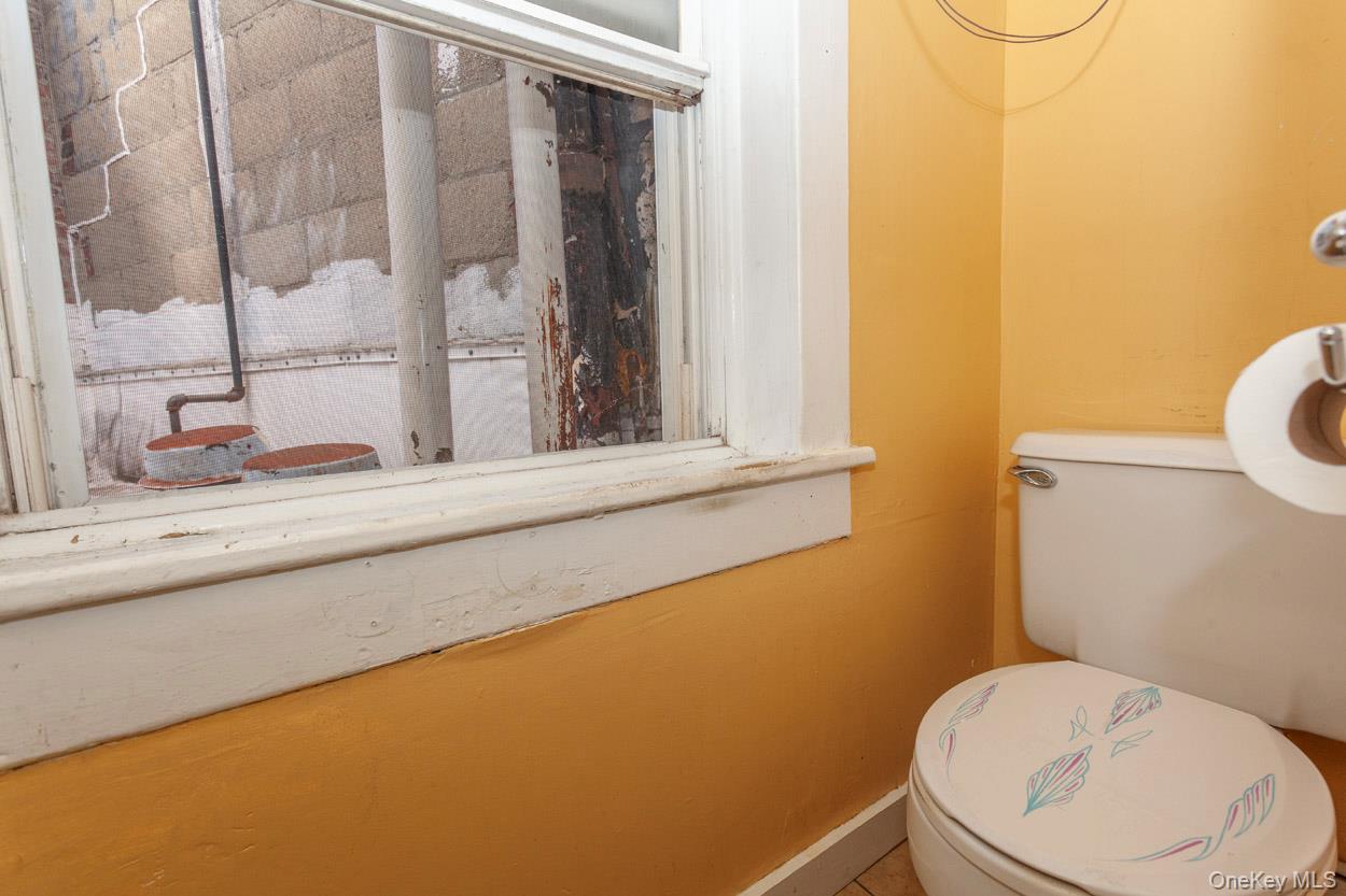 14 South Division Street, Unit 3 Peekskill, NY 10566 - Photo 14 of 17 a bathroom with a toilet and a sink