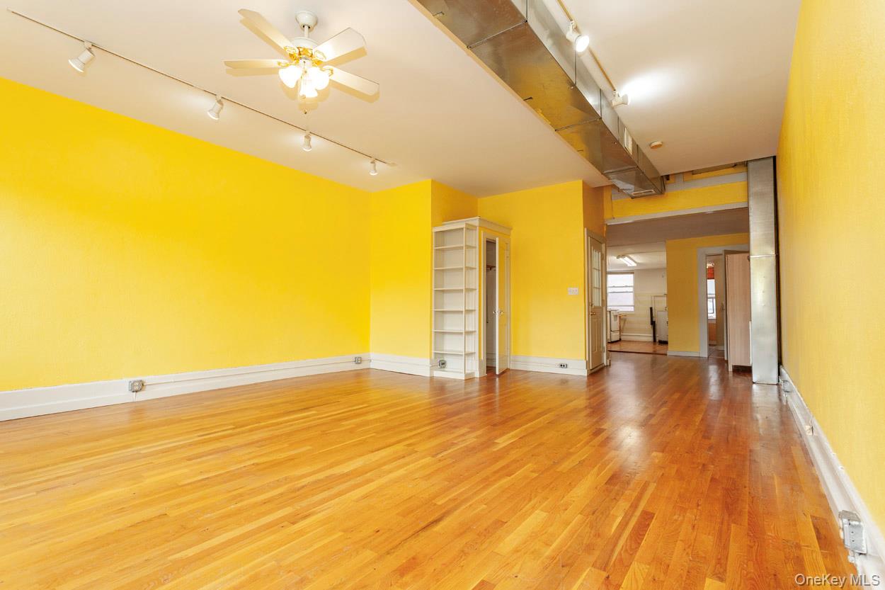 14 South Division Street, Unit 3 Peekskill, NY 10566 - Photo 6 of 17 a view of an empty room with wooden floor