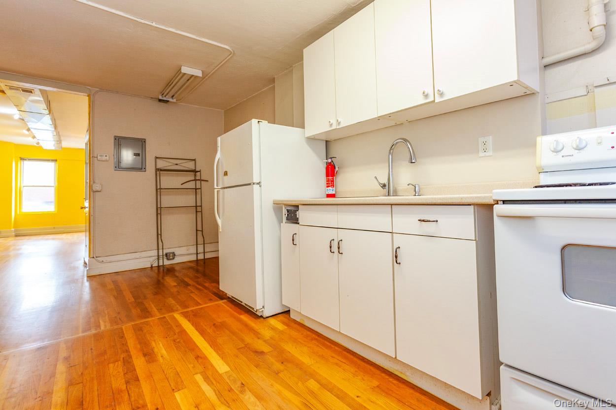 14 South Division Street, Unit 3 Peekskill, NY 10566 - Photo 9 of 17 a kitchen with a sink cabinets and appliances
