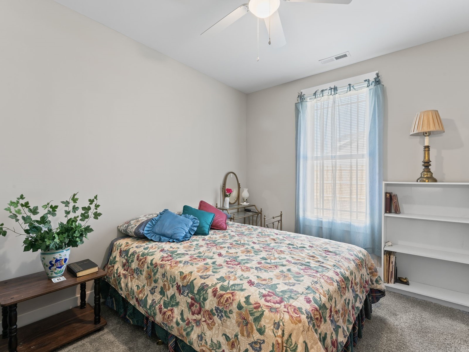 506 Bill Fuson Road McMinnville, TN 37110 - Photo 14 of 22 a bedroom with a bed and a potted plant