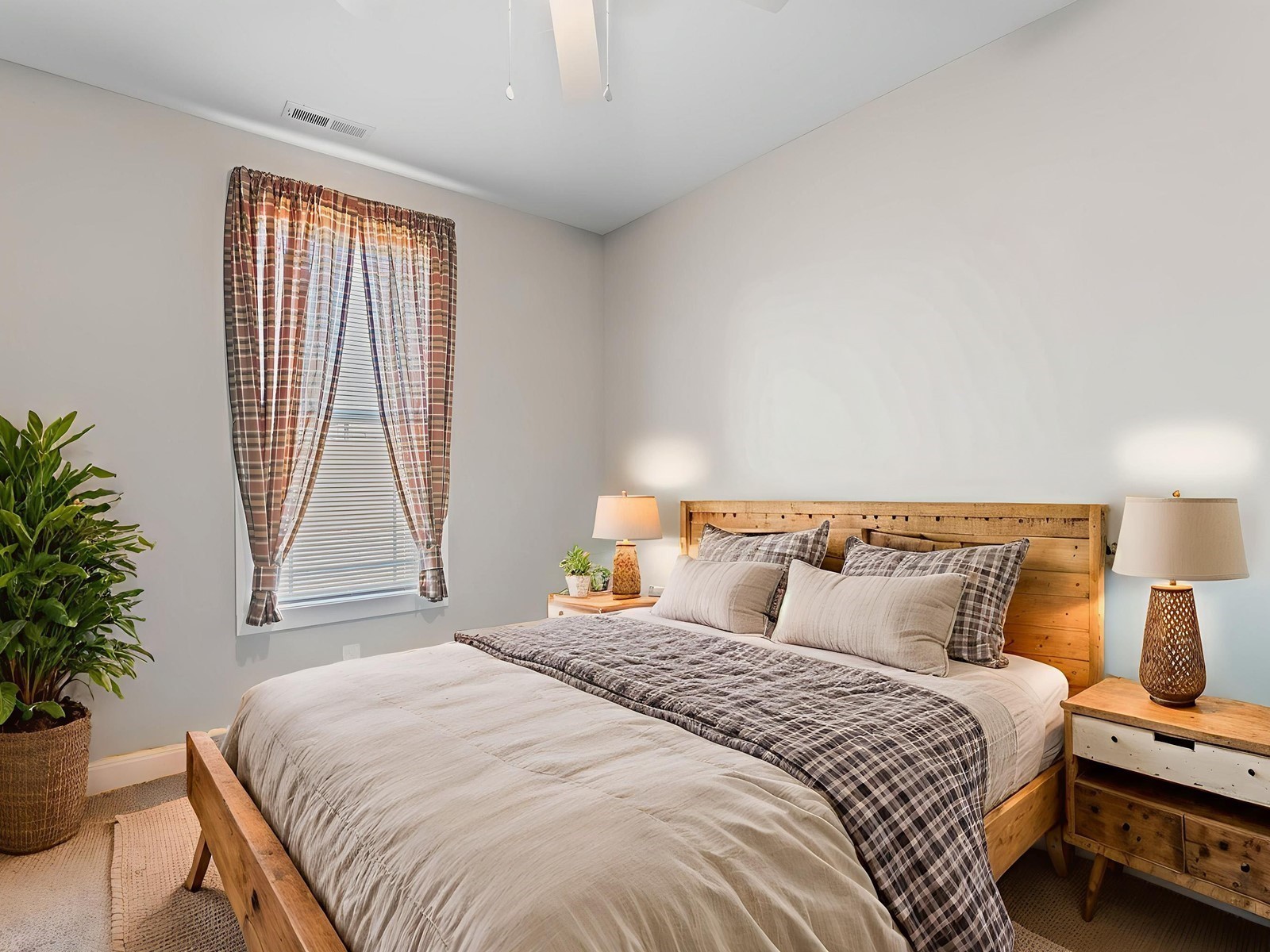 506 Bill Fuson Road McMinnville, TN 37110 - Photo 15 of 22 a bedroom with a bed and a potted plant