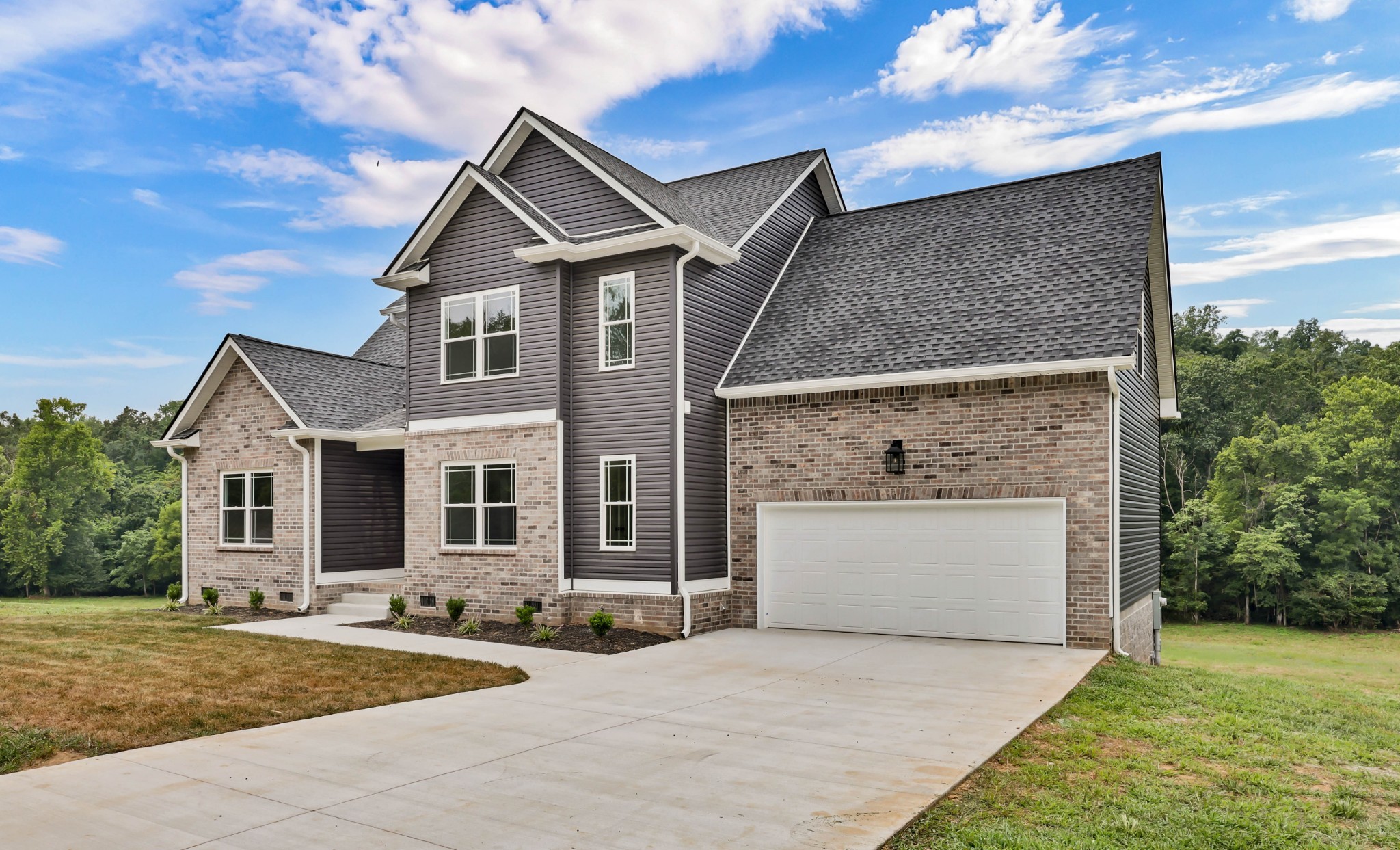 5580 Chambers Road Cumberland Furnace, TN 37051 - Photo 5 of 51 a front view of a house with a yard and garage