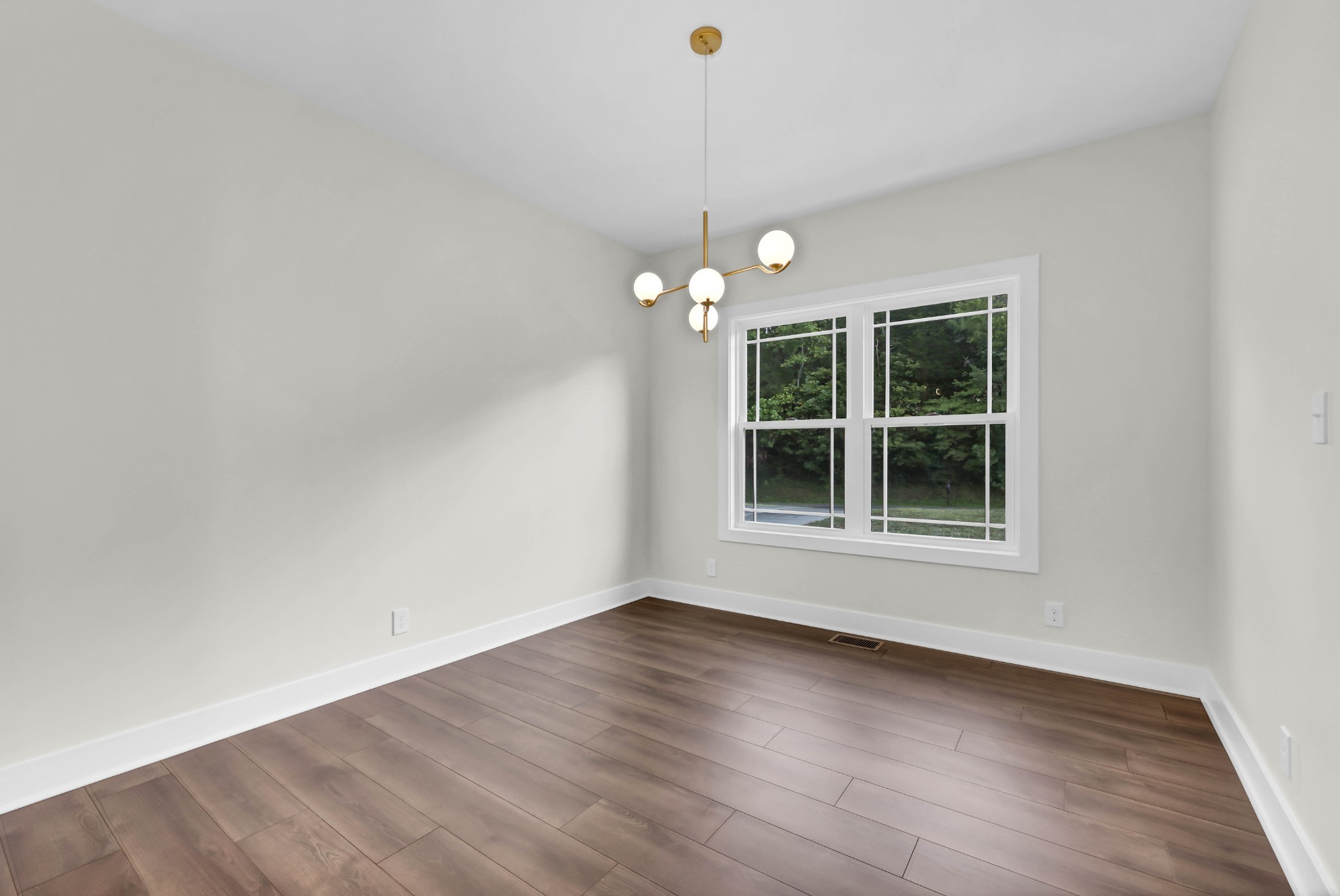 5580 Chambers Road Cumberland Furnace, TN 37051 - Photo 10 of 51 an empty room with wooden floor and windows