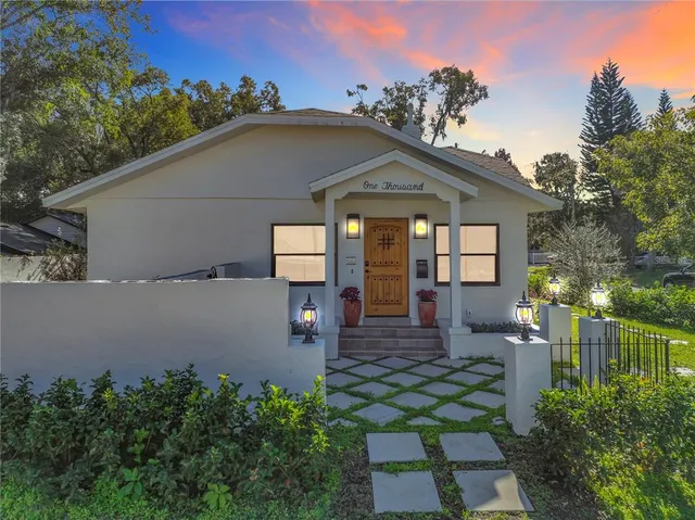 an outdoor view of house with outdoor seating