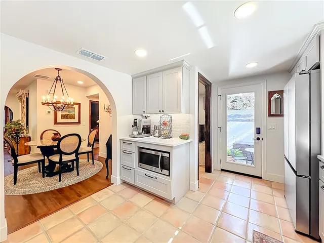 a bathroom with a sink a mirror and a shower