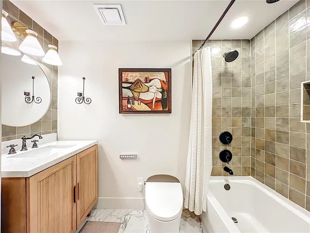 a living room with a couch and a fireplace