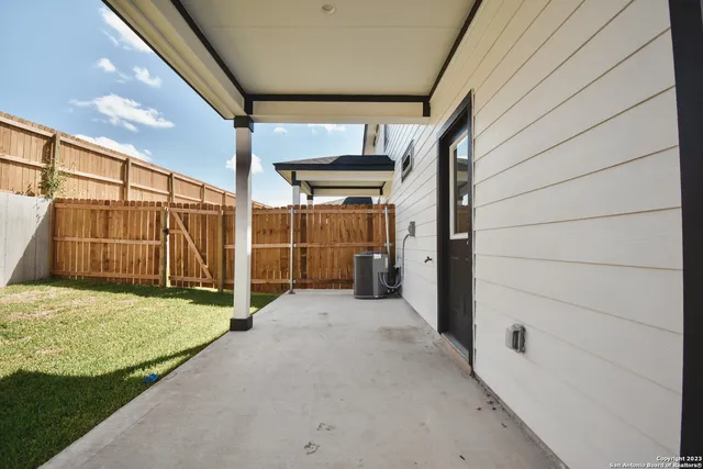 a view of a back yard of the house