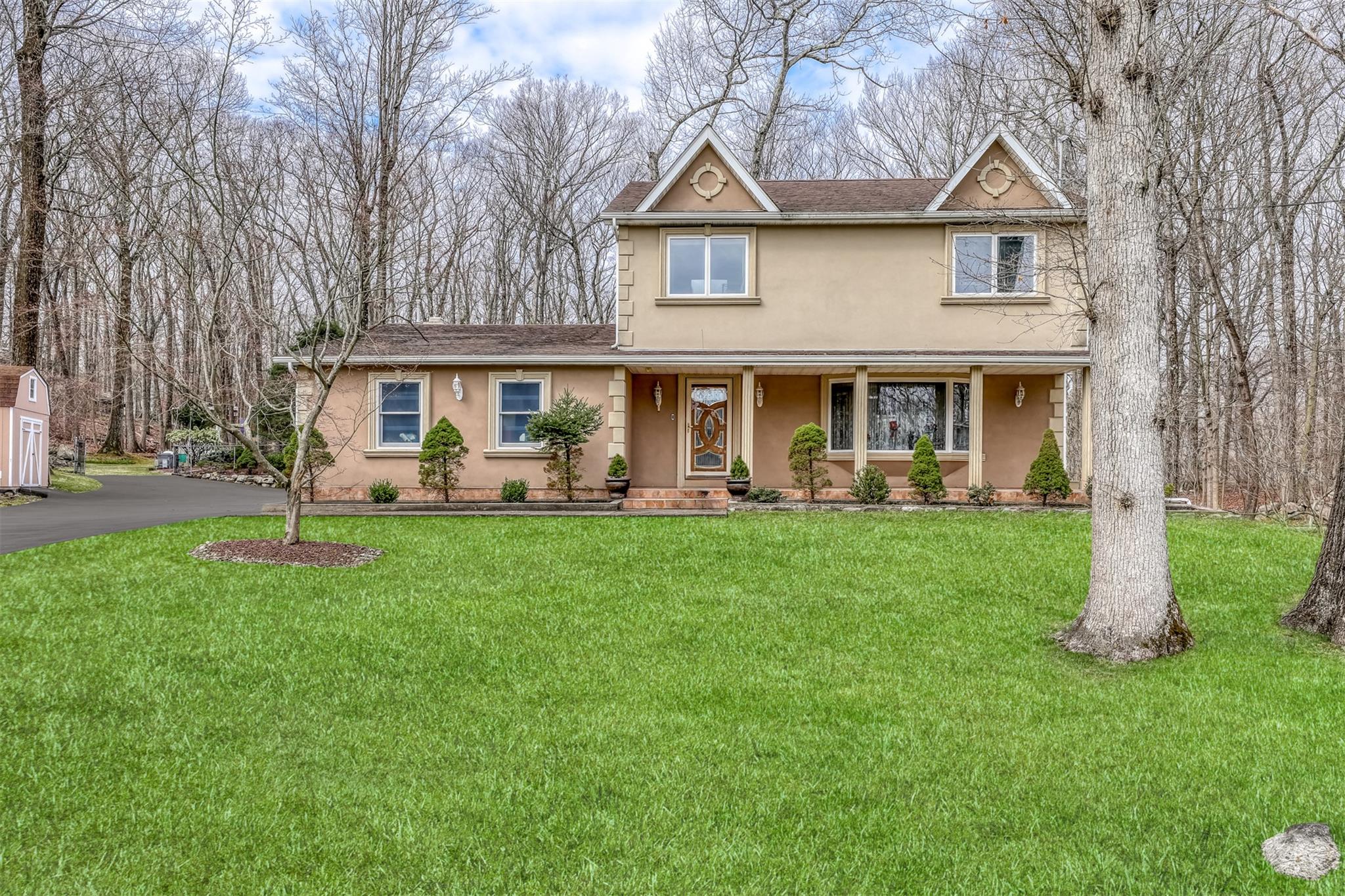 5 Reeder Place Suffern, NY 10901 - Photo 1 of 1 Traditional home with a front yard and stucco siding