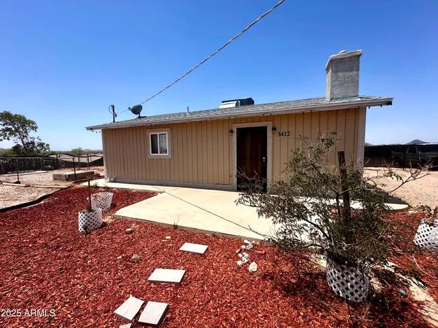 a bedroom with a bed and a mirror