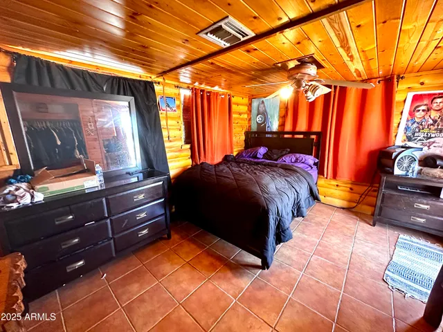 a view of a house with a patio and a yard