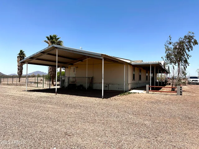 a living room with furniture fireplace and a window