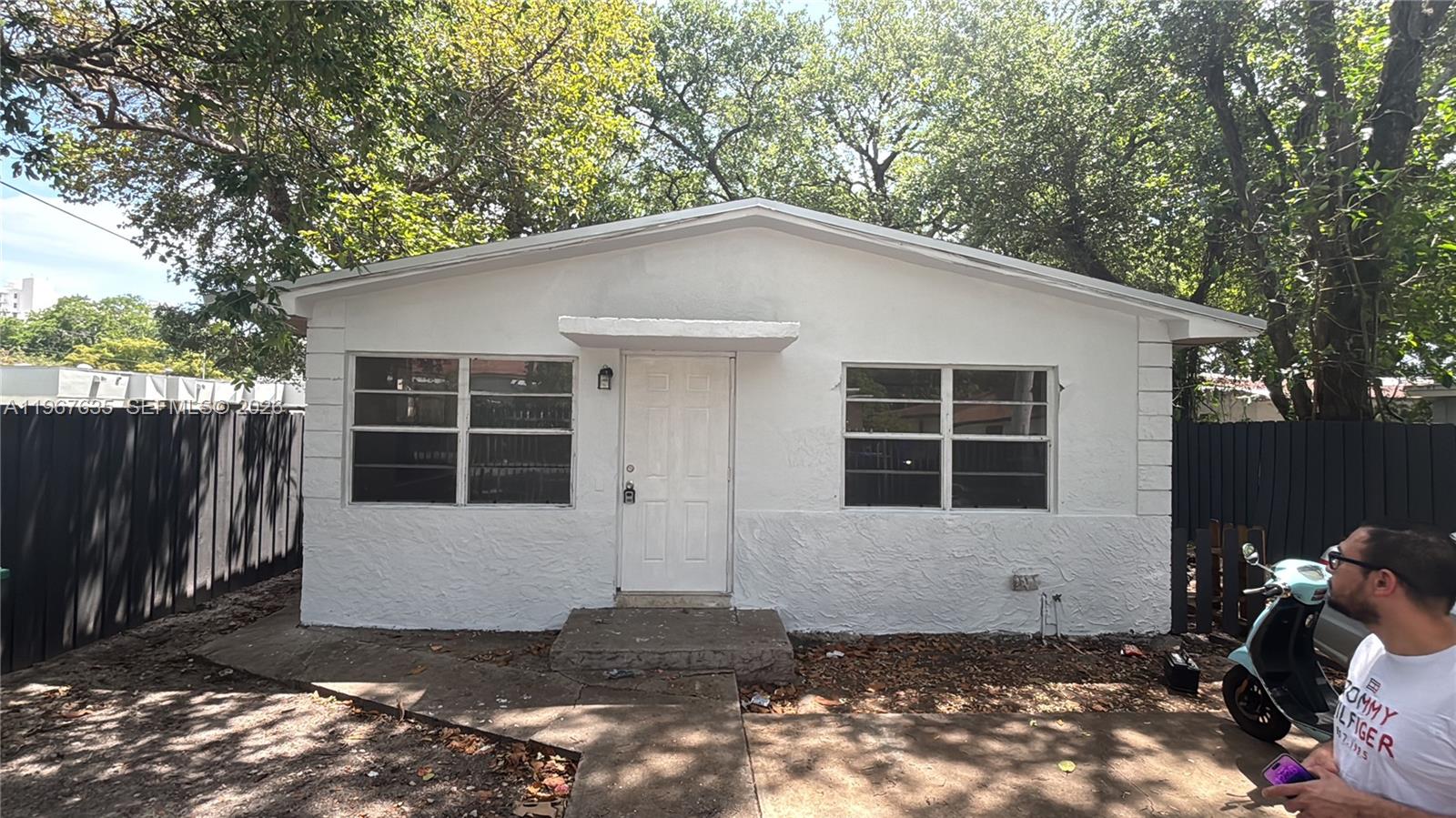 5545 Northwest 3rd Avenue, Unit W Miami, FL 33127 - Photo 1 of 8 a front view of a house with a yard