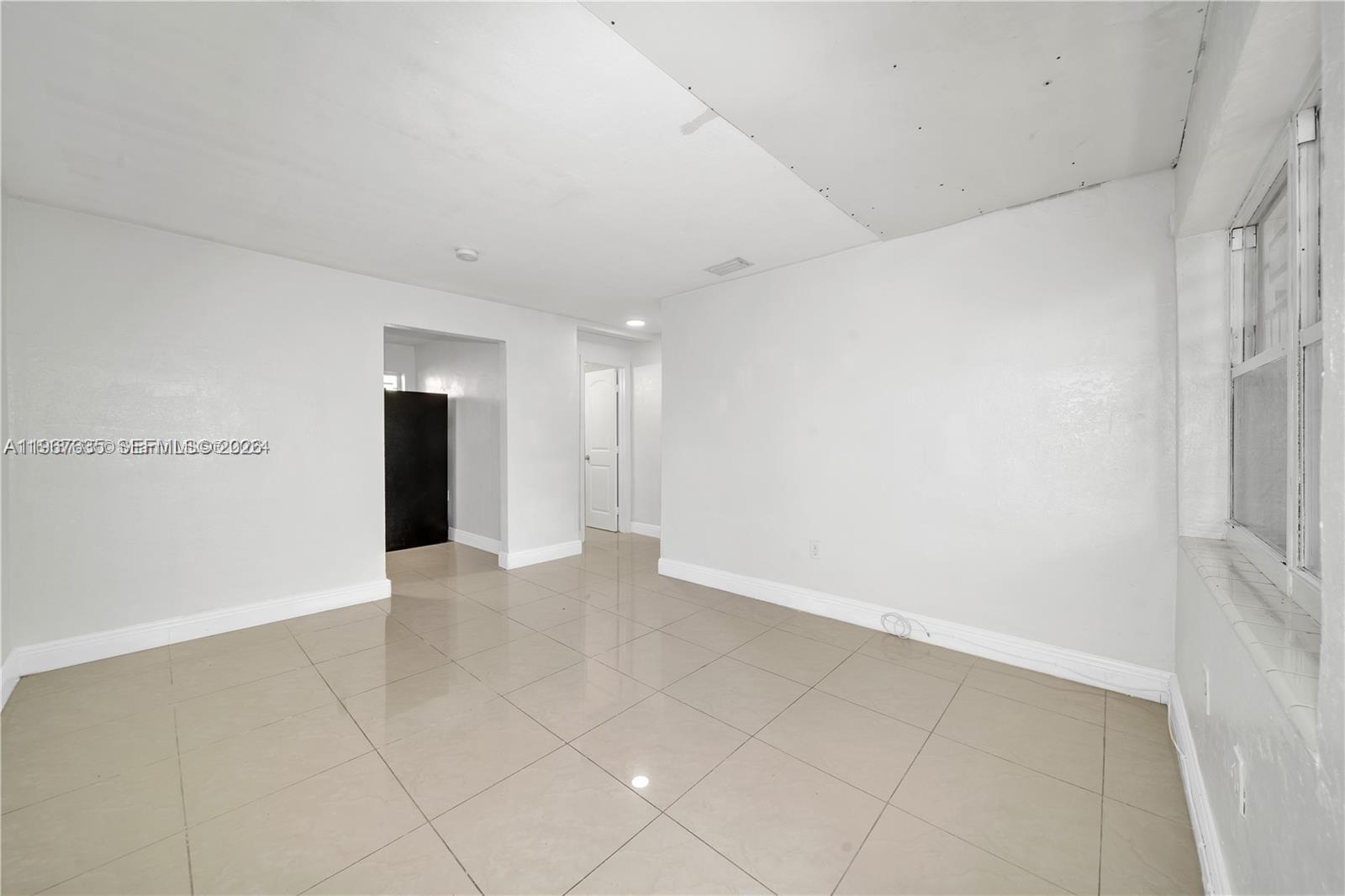 5545 Northwest 3rd Avenue, Unit W Miami, FL 33127 - Photo 5 of 8 a view of an empty room