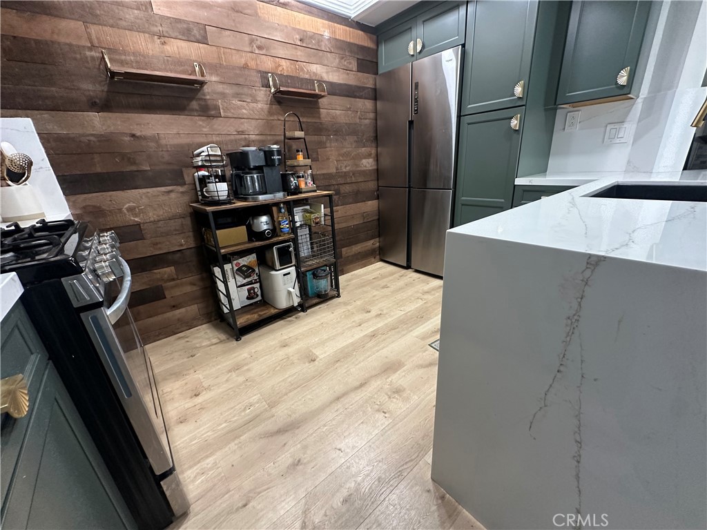 18223 Soledad Canyon Road, Unit 45 Canyon Country, CA 91387 - Photo 18 of 24 a kitchen with a refrigerator