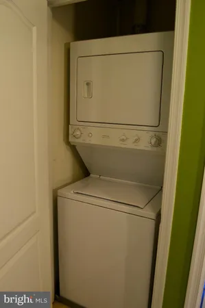 a view of a patio with a table and chairs and potted plants