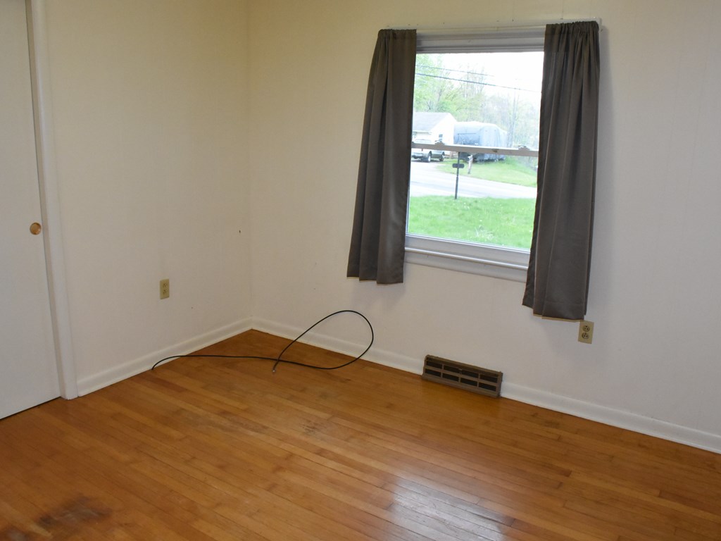 16475 Harmonsburg Road Meadville, PA 16335 - Photo 18 of 35 a room with a window and a wooden floor