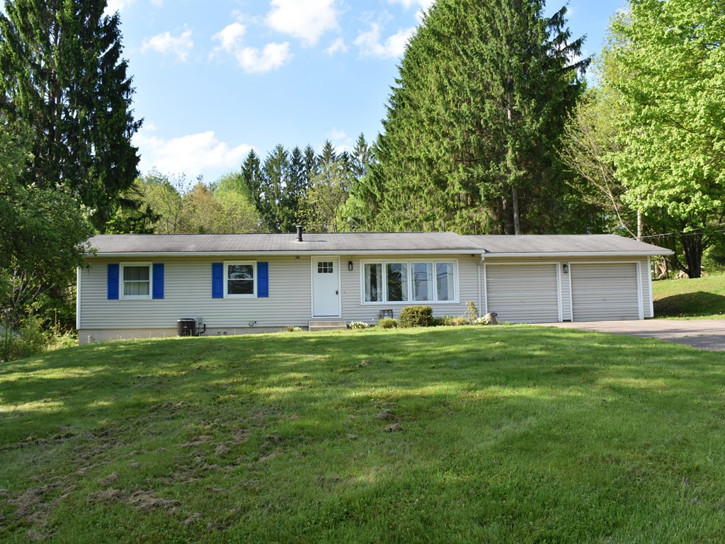 16475 Harmonsburg Road Meadville, PA 16335 - Photo 2 of 35 a front view of a house with a garden