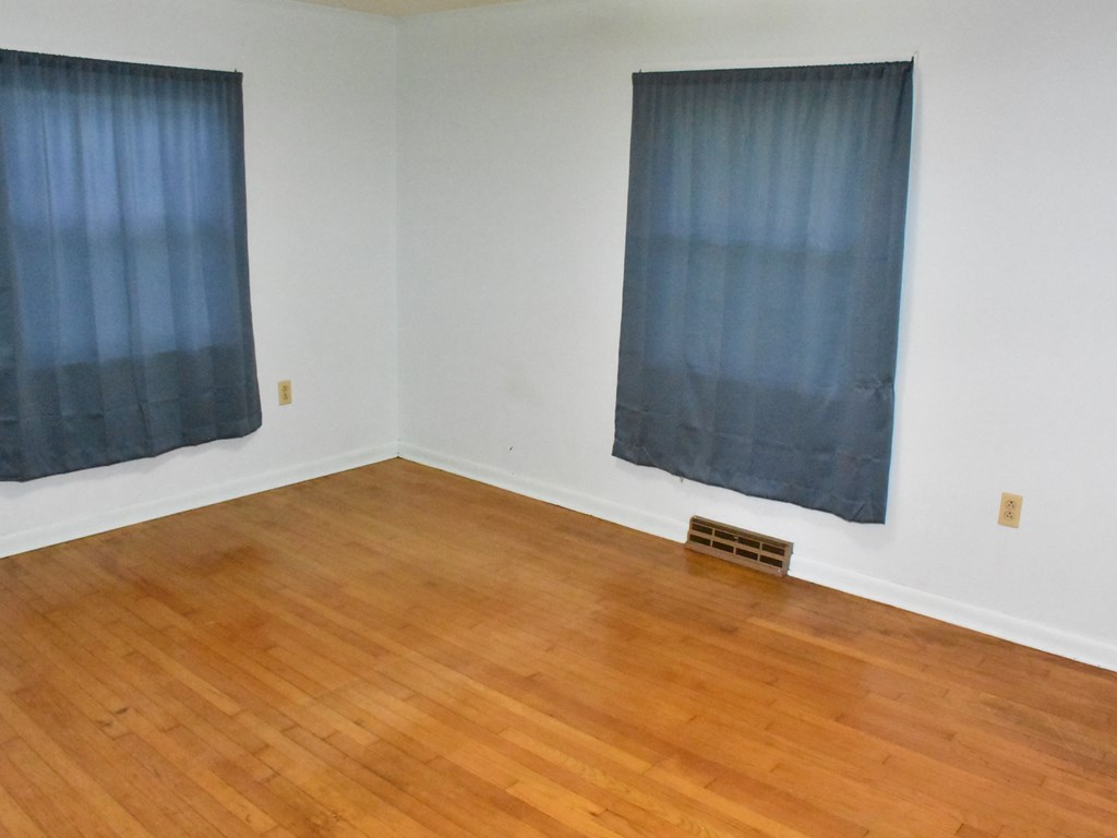 16475 Harmonsburg Road Meadville, PA 16335 - Photo 21 of 35 a view of an empty room with wooden floor