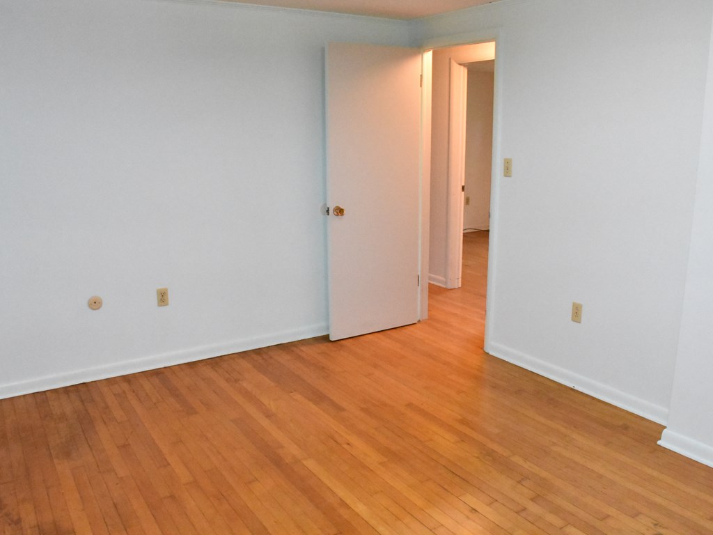 16475 Harmonsburg Road Meadville, PA 16335 - Photo 23 of 35 a view of an empty room with wooden floor and a window