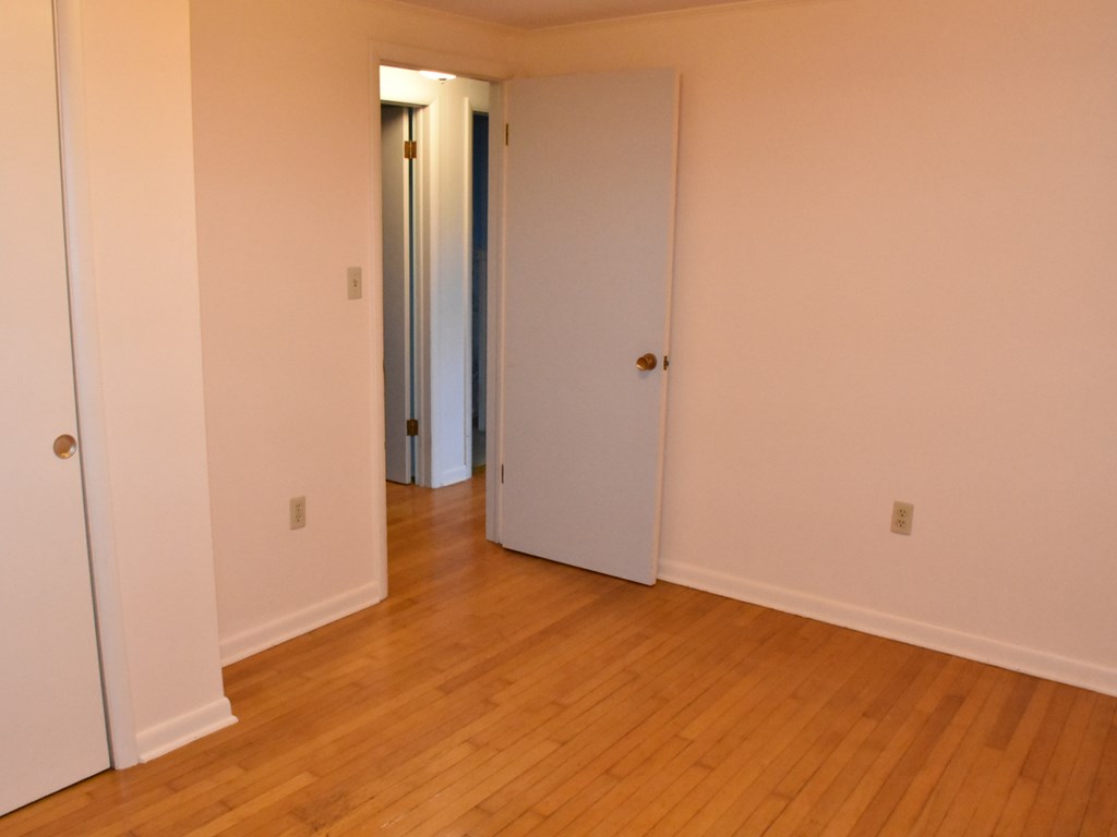 16475 Harmonsburg Road Meadville, PA 16335 - Photo 28 of 35 an empty room with wooden floor and windows