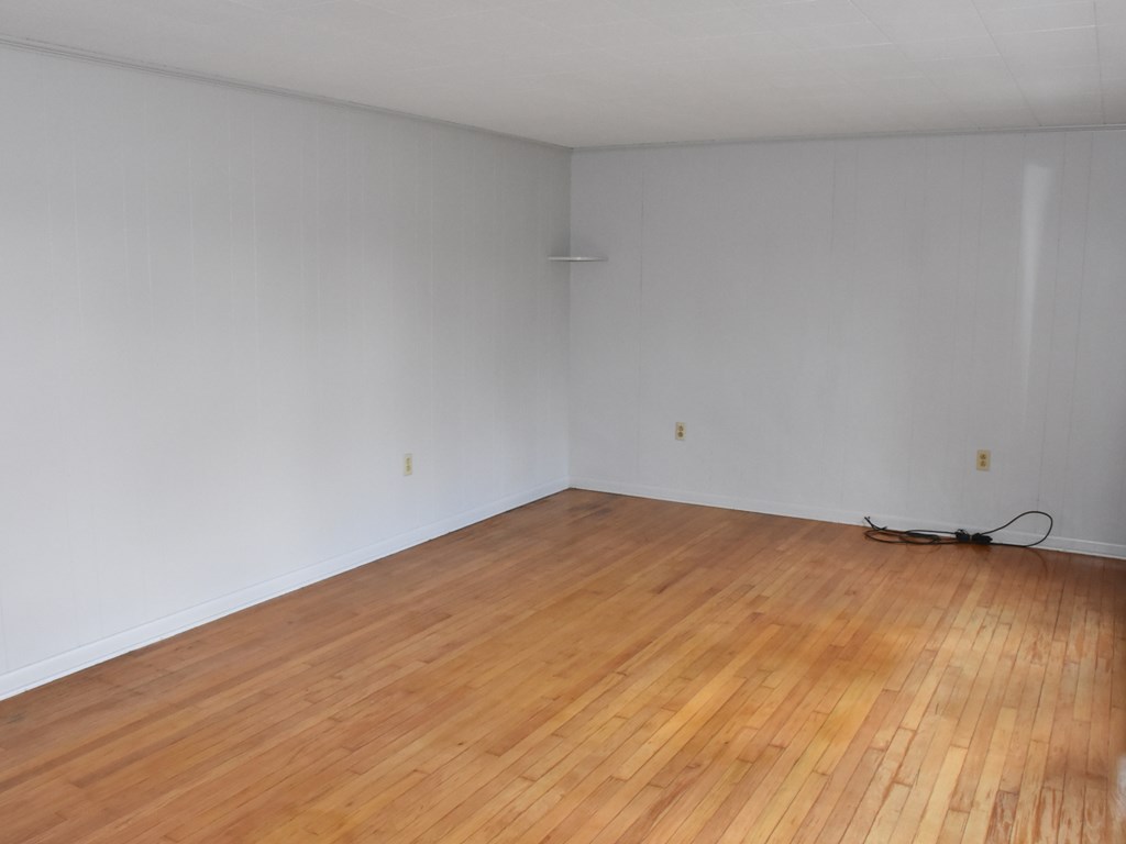 16475 Harmonsburg Road Meadville, PA 16335 - Photo 8 of 35 a view of empty room with wooden floor
