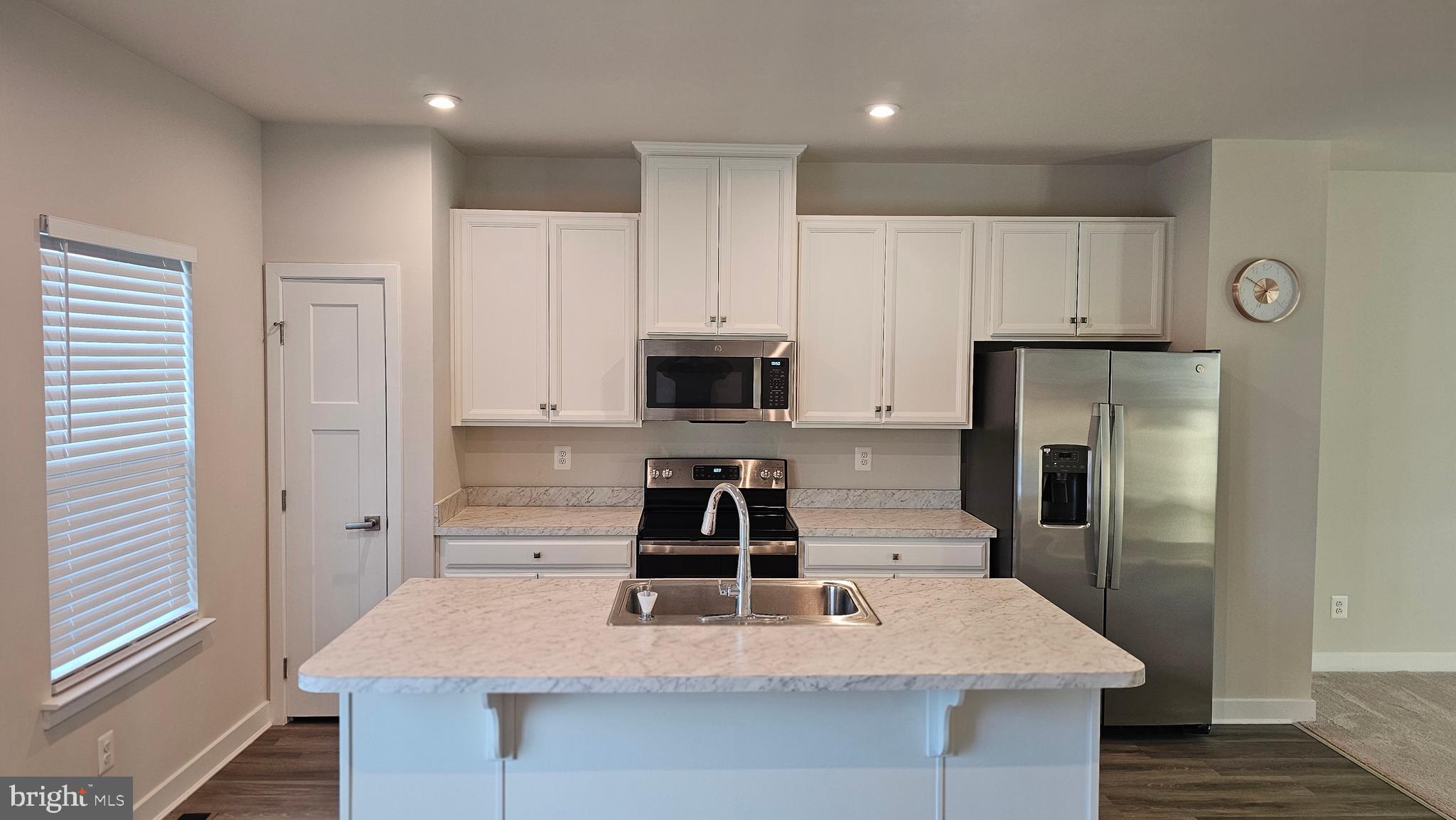 2055 Rivers Drive Newark, DE 19702 - Photo 28 of 48 a kitchen with kitchen island a counter top space cabinets and stainless steel appliances
