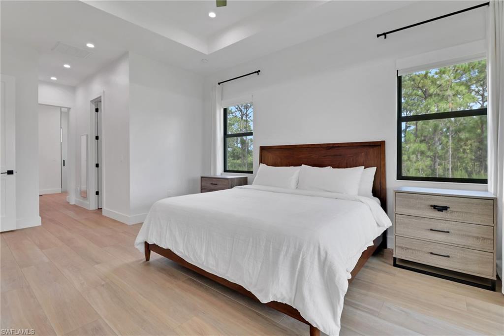 3748 Everglades Boulevard North Naples, FL 34120 - Photo 20 of 49 a bedroom with a bed and a window