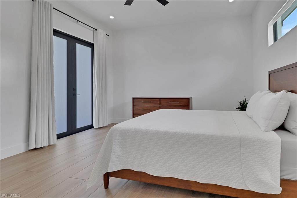 3748 Everglades Boulevard North Naples, FL 34120 - Photo 26 of 49 a bedroom with a bed and a window