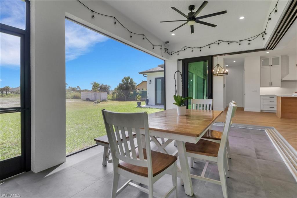 3748 Everglades Boulevard North Naples, FL 34120 - Photo 35 of 49 a view of a dining room with furniture window and outside view