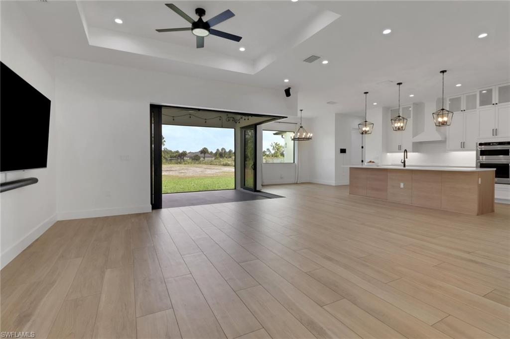 3748 Everglades Boulevard North Naples, FL 34120 - Photo 4 of 49 a view of a living room a flat screen tv