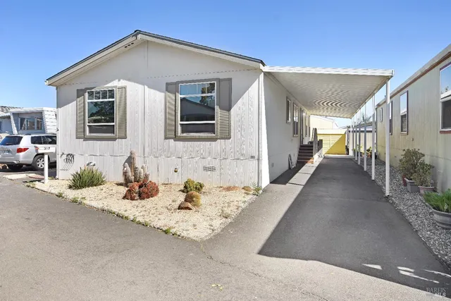 a front view of a house with patio